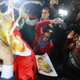 In New Delhi, protesters beat an effigy of Vijayan.